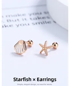 Macro view of 925 silver starfish and shell earrings with rose gold screw back ball