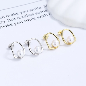 S925 silver and gold irregular freshwater pearl earrings in a minimalist design