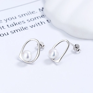 Minimalist irregular S925 silver stud earrings with round freshwater pearls for women