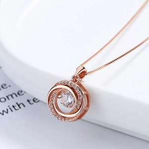 Elegant rose gold dancing heart necklace with a spiral round pendant and sparkling crystal