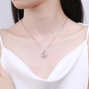 Elegant silver necklace with sparkling vortex pendant and central dancing gemstone