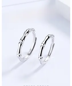 Close-up of S925 sterling silver bamboo joint hoop earrings with inner hallmark engraving