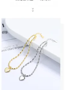 Detailed close-up of heart pendants with beaded edges in gold and silver finish