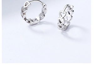 Detailed view of hollow heart-shaped 925 sterling silver hoop earrings for women