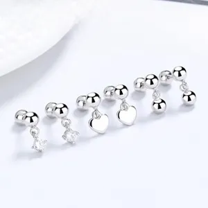 Close-up of 925 sterling silver stud earring set with heart, bead, and square zircon designs