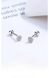 Macro detail of S925 sterling silver round screw back earrings with micro-pave crystals