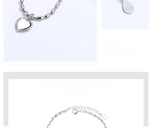 Detailed view of S925 sterling silver beaded bracelet with heart pendant and adjustable chain