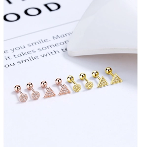 Detail of 925 silver geometric earring set with triangle and round zircon studs