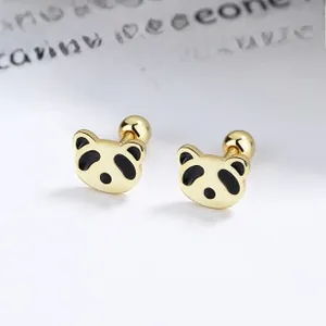 Macro view of gold panda stud earrings with black enamel and screw back ball closure