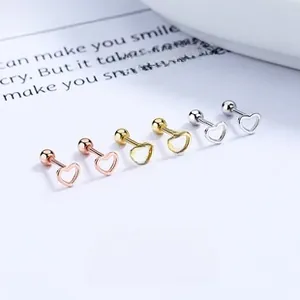Detailed view of hollow heart stud earrings in gold, silver and rose gold with screw backs