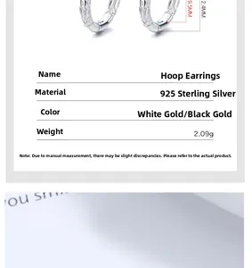 Macro detail of 925 sterling silver hoop earrings with intricate engraved patterns
