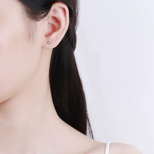 S925 sterling silver minimalist triple bead triangle stud earrings worn on earlobe