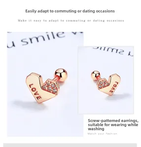 Macro view of rose gold heart stud earring with LOVE engraving and pavé set cubic zirconia