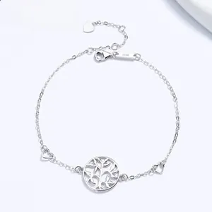 Macro detail of S925 sterling silver bracelet with Tree of Life and heart charms