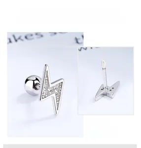 Close-up of S925 silver lightning bolt stud earring with secure screw-back ball and zircons