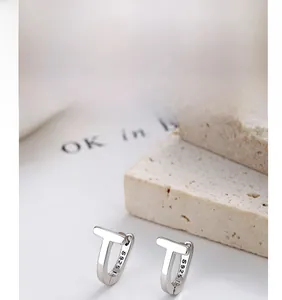 Detail showing S925 hallmark on minimalist T-shaped sterling silver geometric earrings