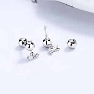 Macro shot of 925 silver bow stud earrings with secure screw back and sparkling crystals