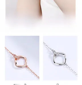 Detail of rose gold and silver Mobius loop bracelets with micro-pave zircon crystals