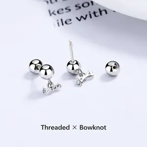 Polished S925 silver bow stud earrings with sparkling stones and screw back closure