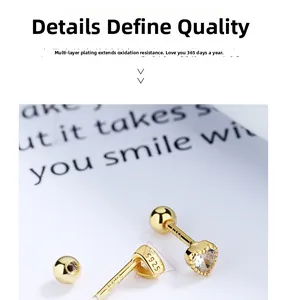 Detail of S925 silver heart stud earrings with clear zircon and screw ball back