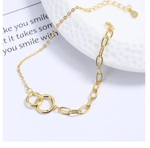 Detailed macro view of S925 sterling silver interlocking double circle golden bracelet