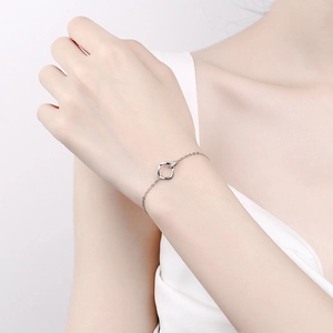Minimalist 925 sterling silver Mobius bracelet with a sparkling square charm on a thin chain