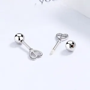 Macro detail of S925 sterling silver heart screw-back earrings with secure threaded design