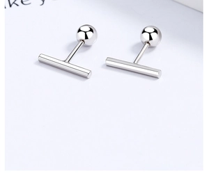 Macro view of minimalist 925 sterling silver bar stud earrings with polished finish