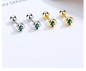 Detail of Christmas tree stud earrings with green crystal and screw back design