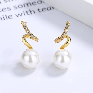 Elegant wavy gold pearl earrings with shimmering zircon stones on a clean white background