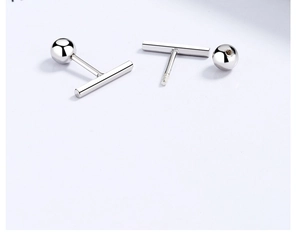 Macro detail of 925 sterling silver T-bar stud earrings with secure screw-back ball closures