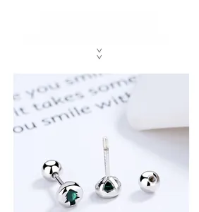 Detailed close-up of 925 sterling silver Christmas tree stud with green crystal and screw back