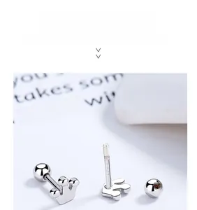 Macro shot of silver crown screw-back earring with S925 sterling silver hallmark detail