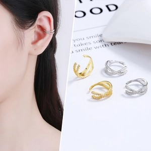 Close-up of S925 silver crisscross ear cuff with zircons in gold and silver finish