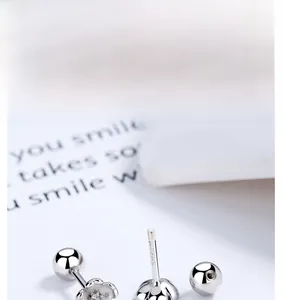 Close-up of S925 sterling silver cherry blossom earring with secure screw back and engraving