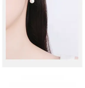 Close-up of pearl leaf earring worn on ear showing elegant silver craftsmanship