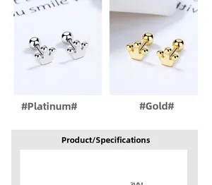 Macro shot of 925 silver crown stud earrings in gold and platinum finishes