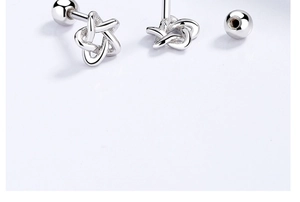 Macro shot of S925 sterling silver star screw-back earrings with hollow pentagram design