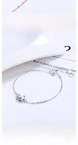 Close-up of S925 sterling silver Mobius bracelet with delicate interlocking diamond rings