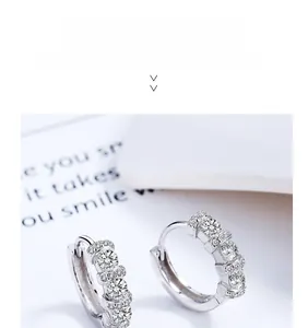 Close-up of S925 silver hoop earrings with double row sparkling zircon stones
