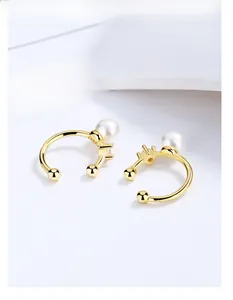 Detail of S925 sterling silver pearl ear cuff with gold plating and zircon inlay