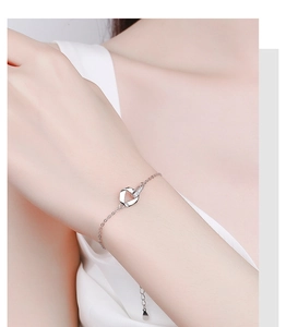 Detailed view of Mobius 925 silver bracelet with sparkling zircon on model's wrist