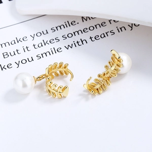 925 silver leaf pearl drop earrings in gold finish on a minimal white background