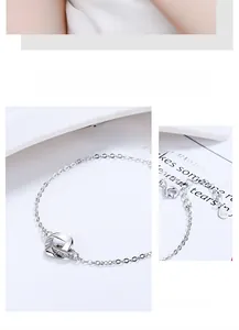 Detail of S925 sterling silver Mobius bracelet with interlocking rings and zircon pave