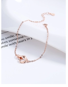 Close-up of interlocking rose gold circles on a fine 925 sterling silver chain
