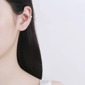 Minimalist 925 sterling silver ear cuff with white pearl worn on the ear cartilage