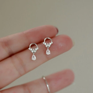 Close-up of 925 sterling silver drop earrings with sparkling cubic zirconia stones