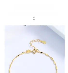 Detail of 925 sterling silver gold bracelet with spring ring clasp and S925 hallmark