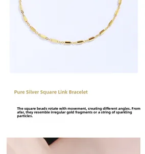 Close-up of 925 sterling silver cube bead bracelet with elegant gold finish and fine chain