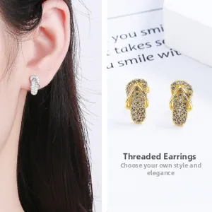 Close-up of 925 sterling silver flip-flop earrings with pave cubic zirconia and screw back